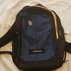 Navy Blue and yellow Timbuk2 backpack